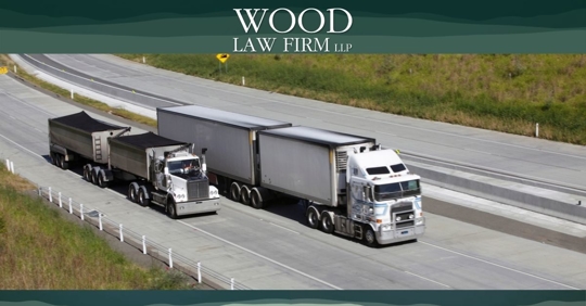 Large truck overtaking small truck on highway