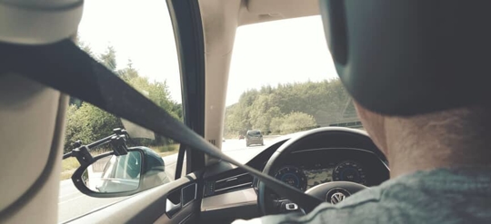 Driver wearing seatbelt in car