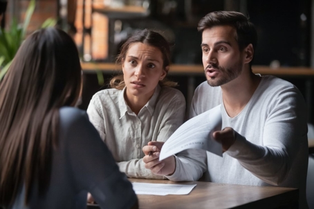 Couple arguing with insurance agent