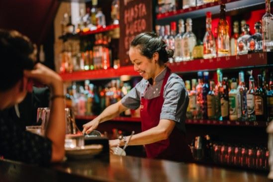 bartender serving alcohol